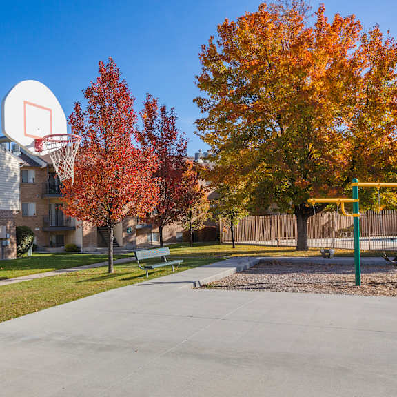 a basketball court is located in front of a house.