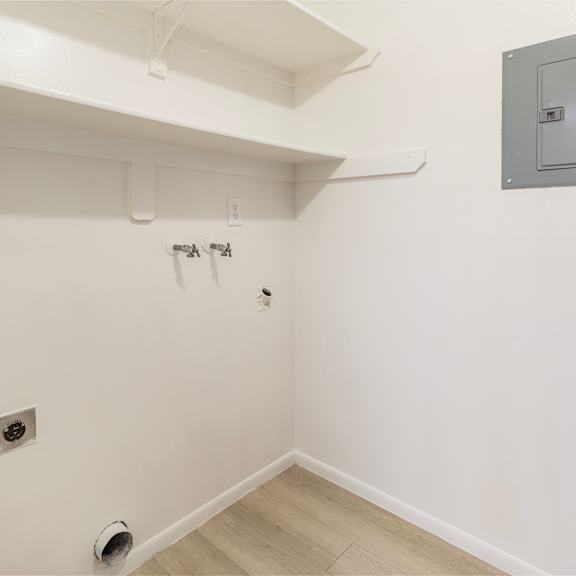 a white bathroom with a shower and a toilet.