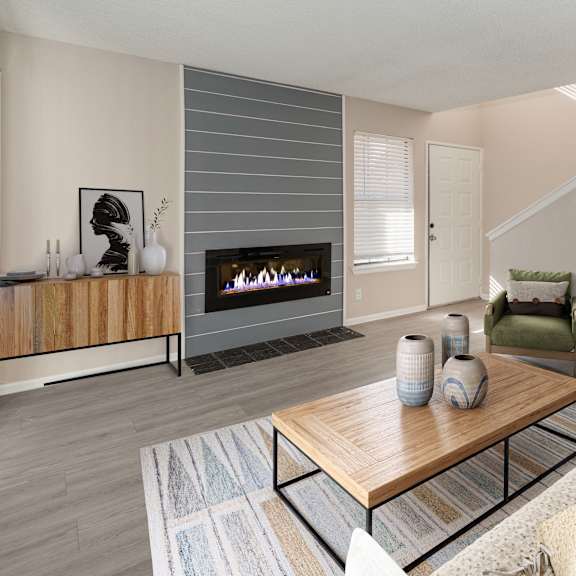 a living room with a fireplace and a couch.