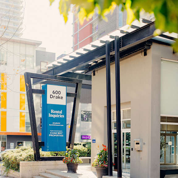 the facade of a building with a blue sign that reads 2020 direct