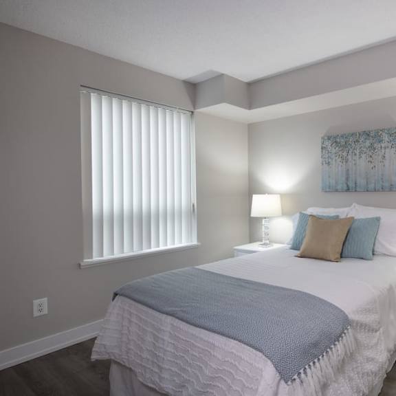 a bedroom with a bed and two night stands