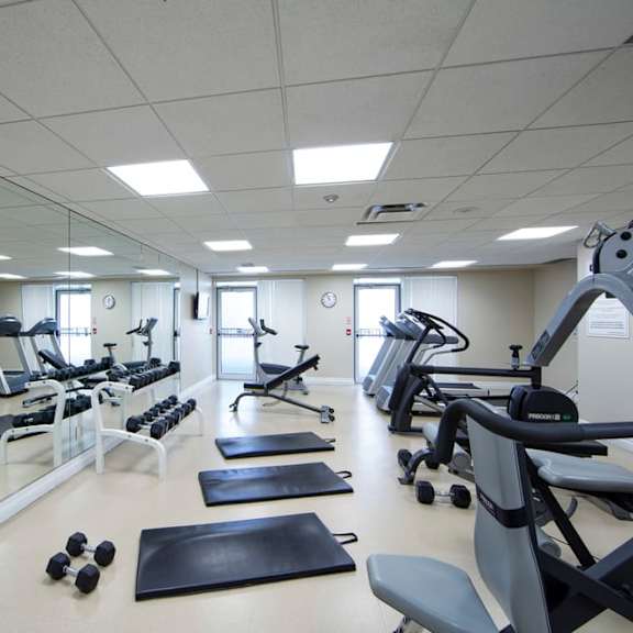 a fitness center with treadmills and other exercise equipment