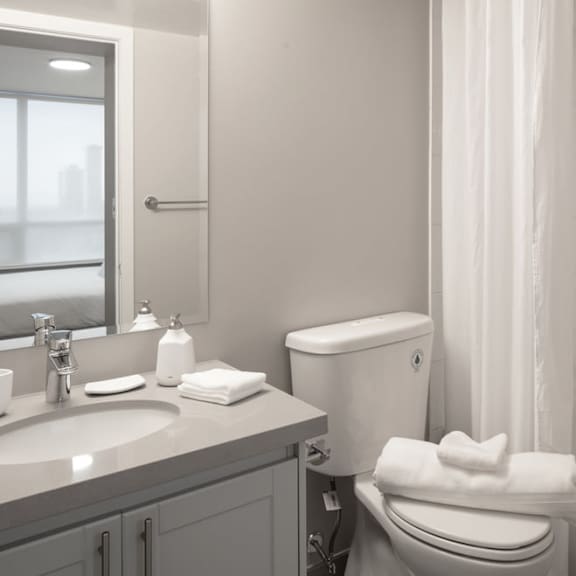 a bathroom with a toilet sink and bathtub