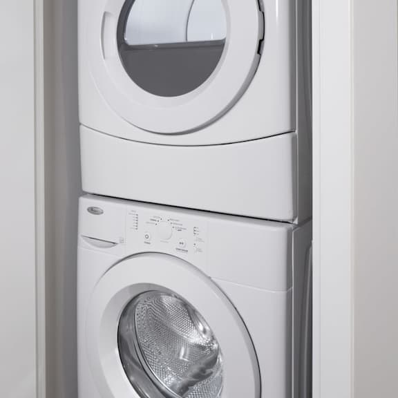 a front loading washer and dryer in a bathroom