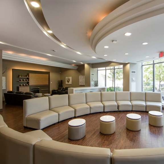 a large room with a couch and chairs