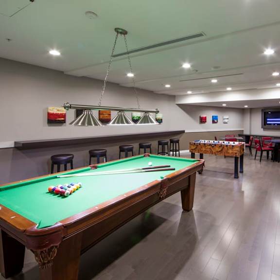 we have a large games room with a pool table and a foosball table