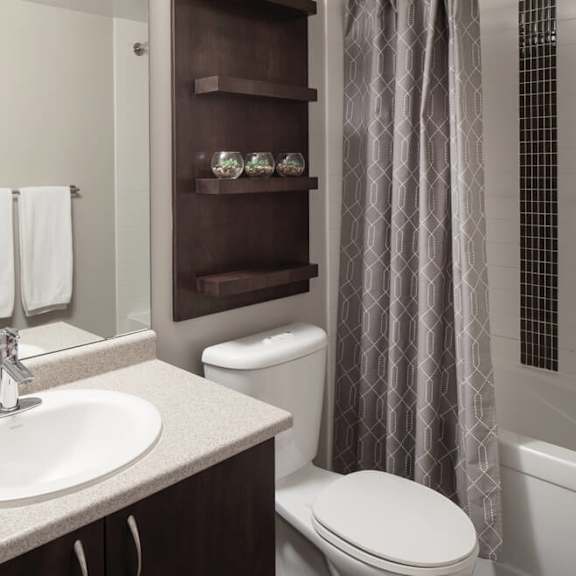 a bathroom with a sink toilet and bathtub