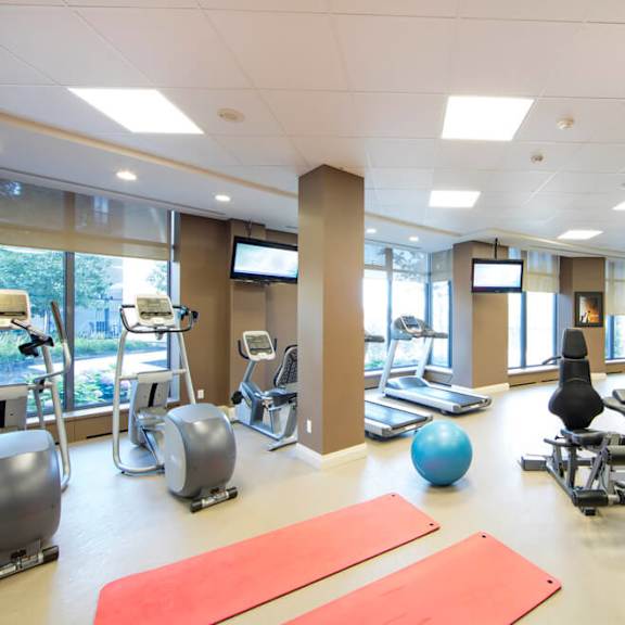 a room filled with lots of different types of exercise equipment