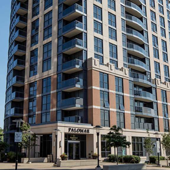 a large building with balconies and a sign that reads palomar