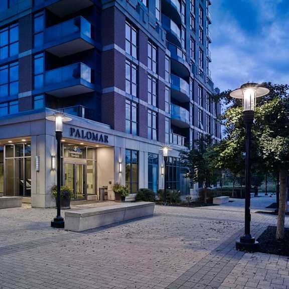 a building with a sign that reads palomar on the front of it