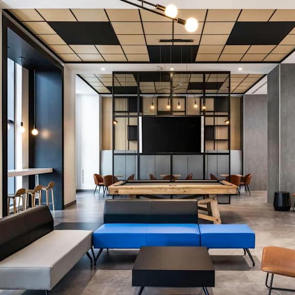 a room filled with furniture and a large window