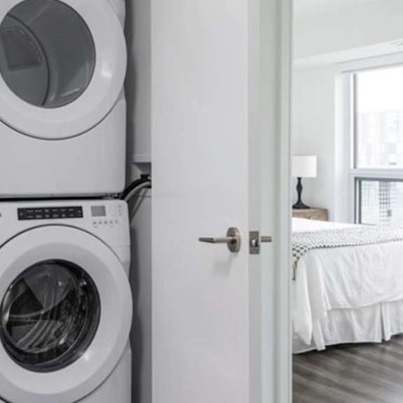a white washer and dryer in a white room