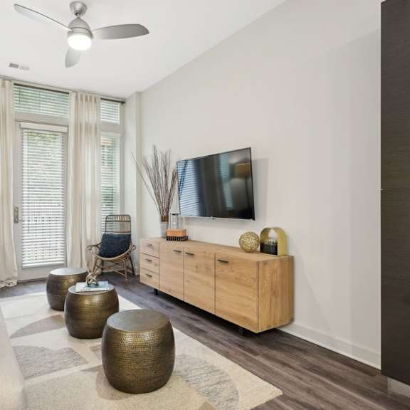 a living room with a couch and a tv
