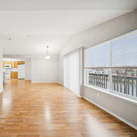 a room with wooden floors and white walls.