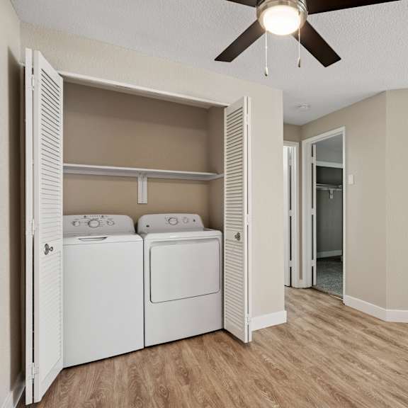 a laundry room with a washer and dryer in it.