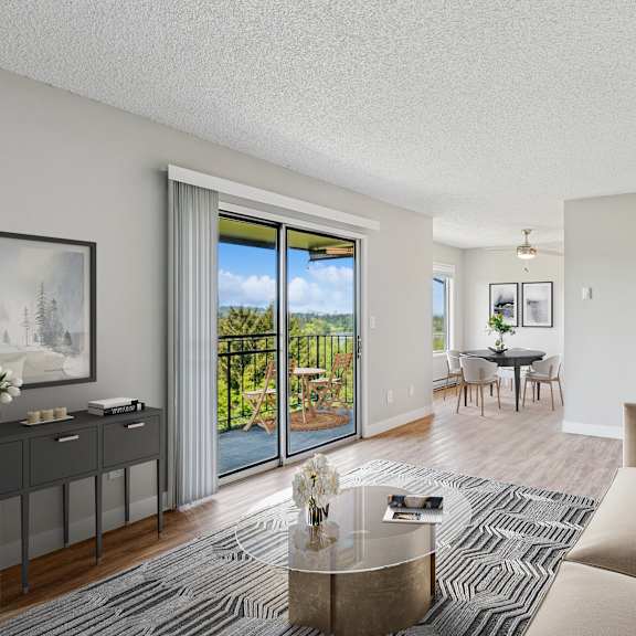 a living room with a large window and a view of the outdoors.