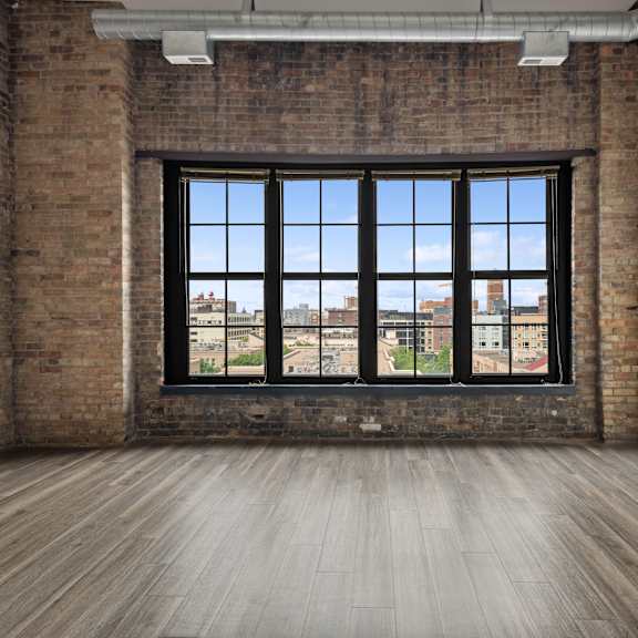 an empty room with a large windowat gaar scott historic lofts, minnesota
