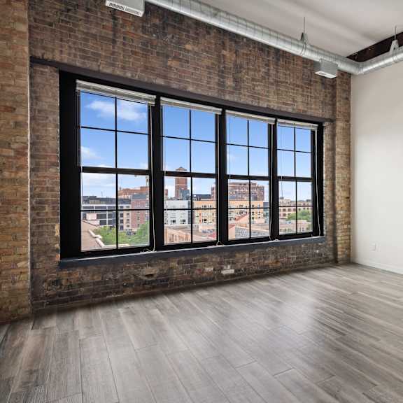 an empty room with a large windowat gaar scott historic lofts, minnesota, 55401
