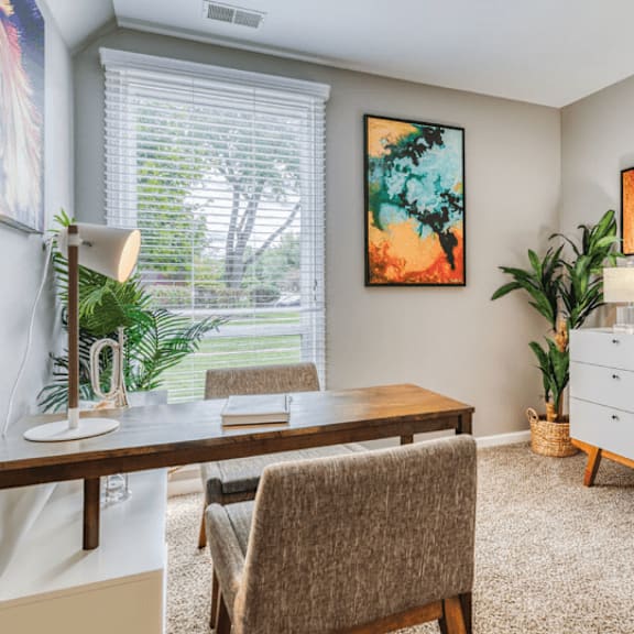 a home office with a desk and a dresser at the view apartments st charles, st charles, il