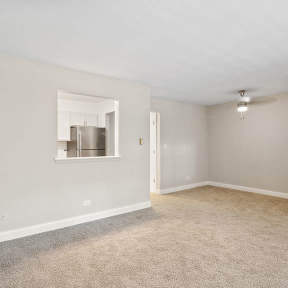 a bedroom with a large window at the hinsdale, hinsdale