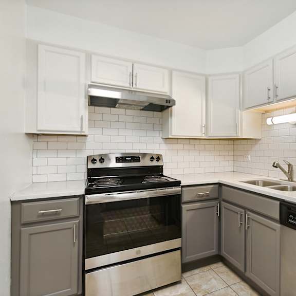 a kitchen with white cabinets at the hinsdale, hinsdale, il, 60521