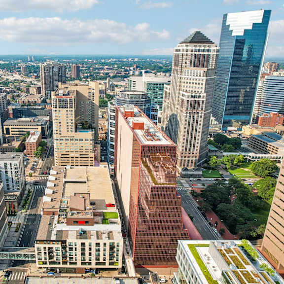 a cityscape with various buildings and a clear sky.