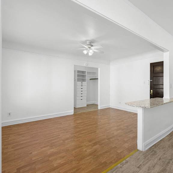 a room with wooden floors and white walls at pleasant oak apartments, illinois