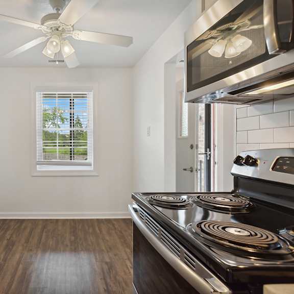 a kitchen with stainless steel appliances and a ceiling fan at the hinsdale, hinsdale, il, 60521