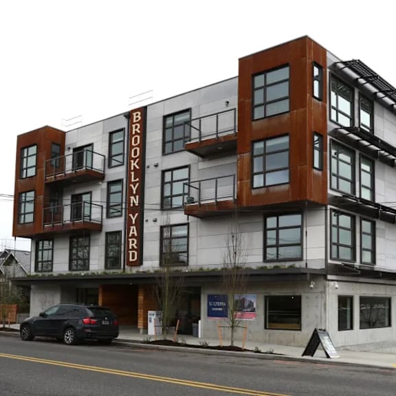 modern mixed material building exterior with street view at brooklyn yard apartments, portland, or 97202