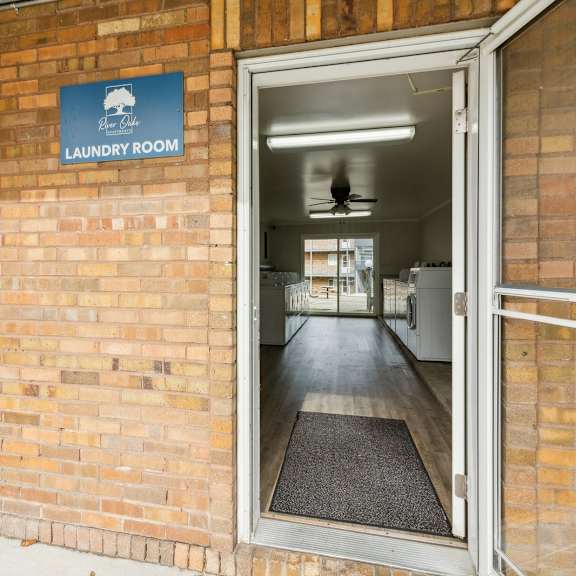 the door to the laundry room is open in a brick building at river oaks, north aurora, illinois