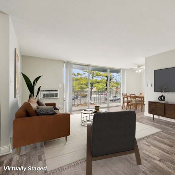 a living room with a couch, chair, and television.