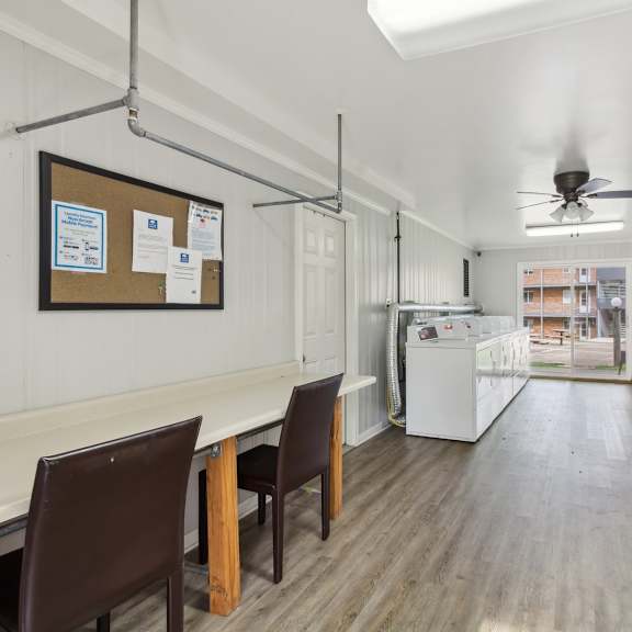 a kitchen and dining room with white appliances and a ceiling fan at river oaks, north aurora, illinois