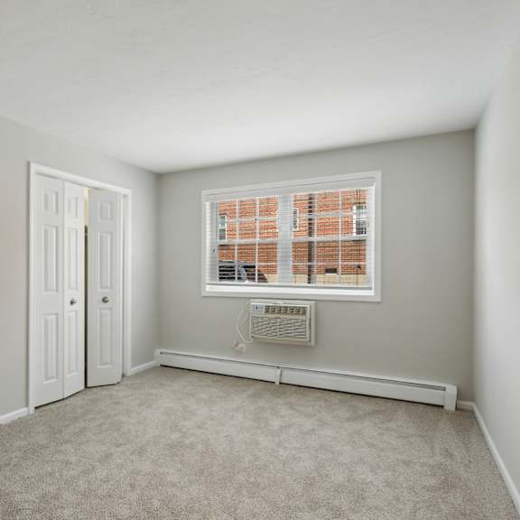 a bedroom with grey walls and carpet at the hinsdale, hinsdale, 60521