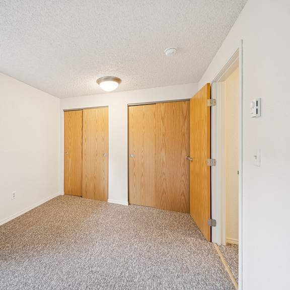 a room with two doors and a window.