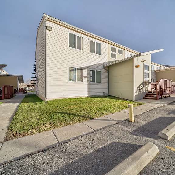 a residential area with houses and a parking lot.