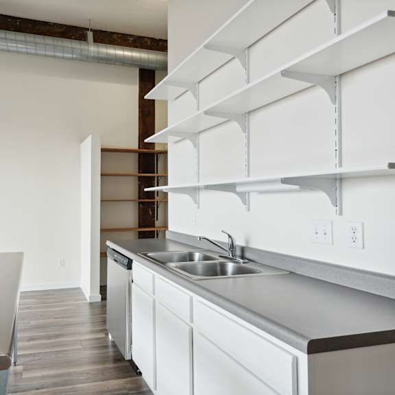 a kitchen and dining area in a 555 waverly unitat gaar scott historic lofts, minnesota