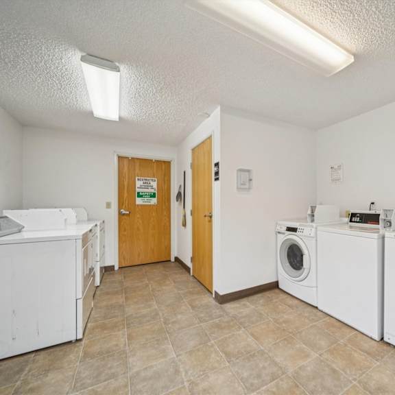 a laundry room with a washer and dryer.