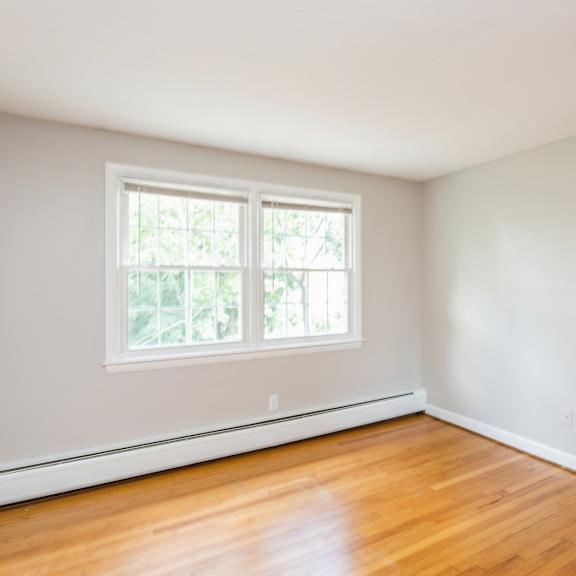 empty room with hardwood floors and a window