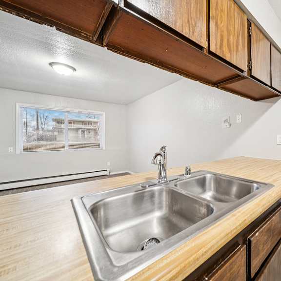 a kitchen with a sink and a dishwasher.