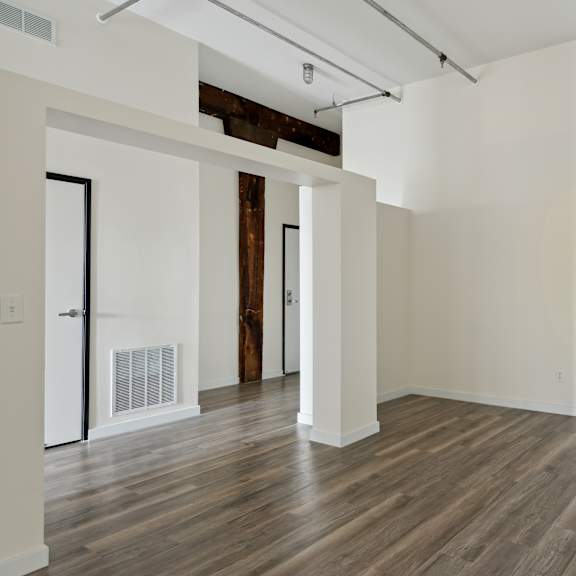 an empty room with hardwood floors and white wallsat gaar scott historic lofts, minneapolis, minnesota