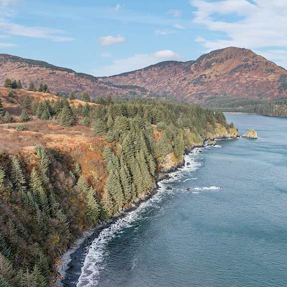 a large body of water with a landmass on the other side.