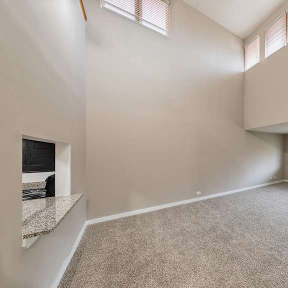 a spacious room with a large window and high ceilings at oak park city, oak park, 60301