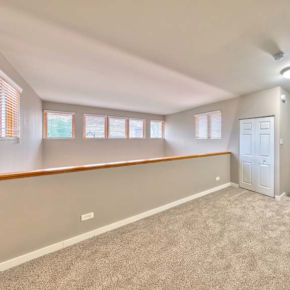 a room with a carpeted floor and a door on the right side. at oak park city, illinois, 60301