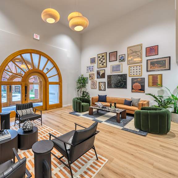lobby with chairs, pictures and high ceilings at oak park city, oak park, 60301