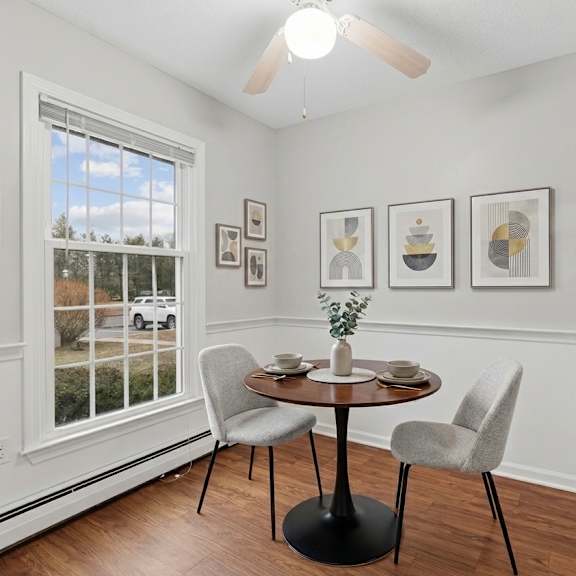 a dining room with a table and chairs.