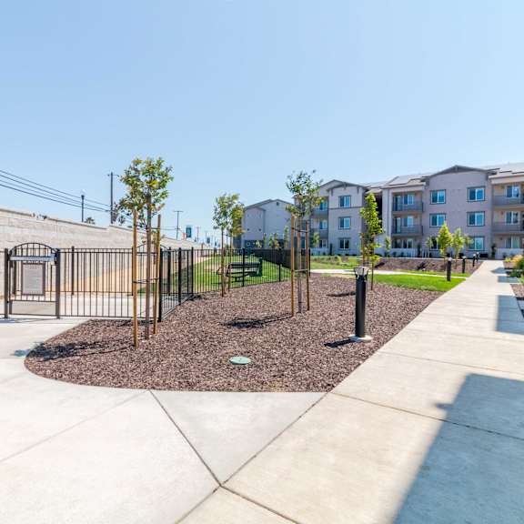 a walkway along apartment buildings