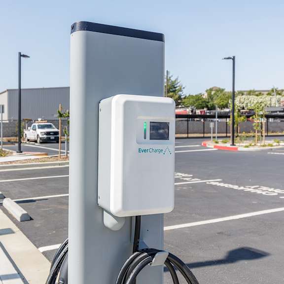 a charging station for electric vehicles is shown in a parking lot.
