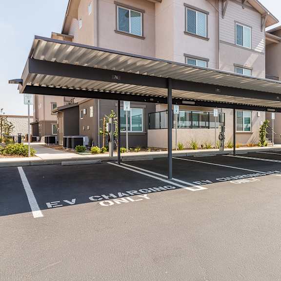 a parking lot with carports.