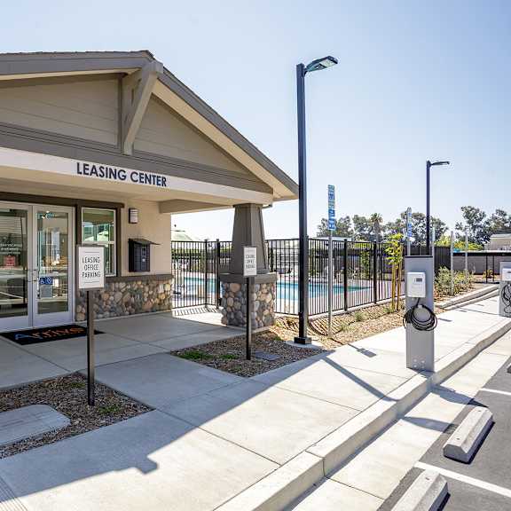 leasing center with a stone pillar.