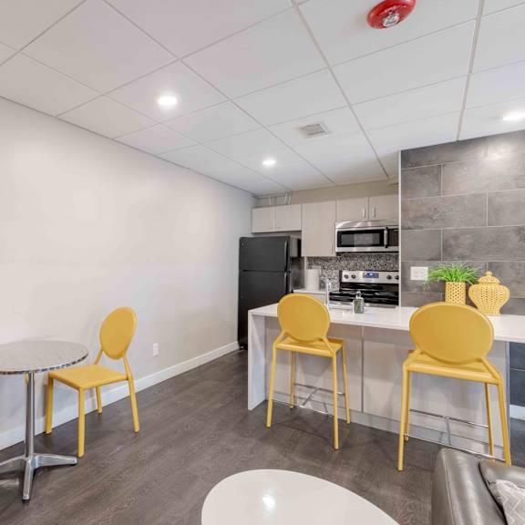 a kitchen with a table and chairs.